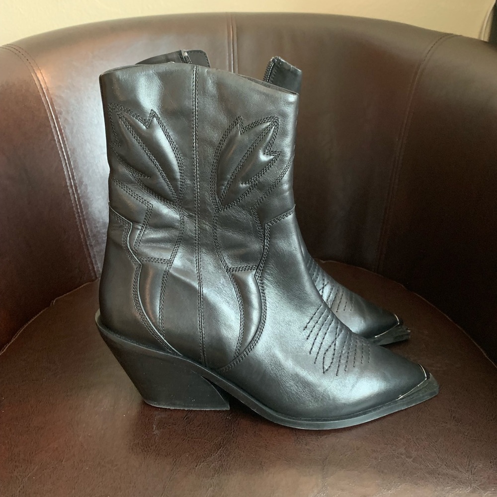 Woman’s leather black boots.